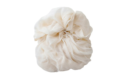 Natural cotton cheesecloth loosely gathered on a white background; select the one-sheet or four-sheet pack.