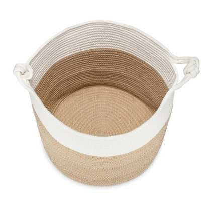 Overhead view of the empty cream and beige rope basket and its woven base.