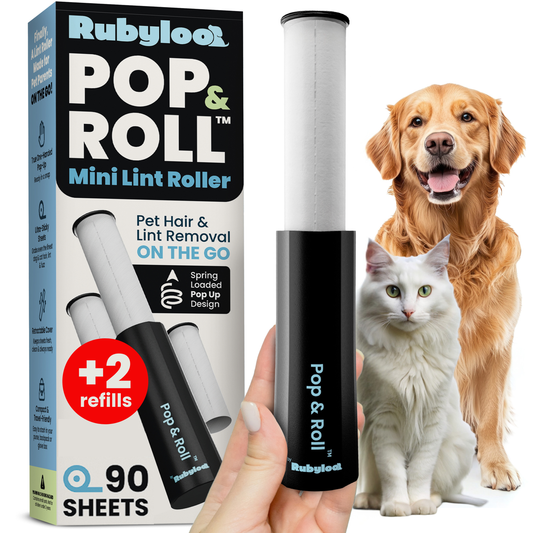 Rubyloo Pop & Roll mini lint roller held beside its one-pack box marked two refills and 90 sheets, with a dog and cat pictured alongside.