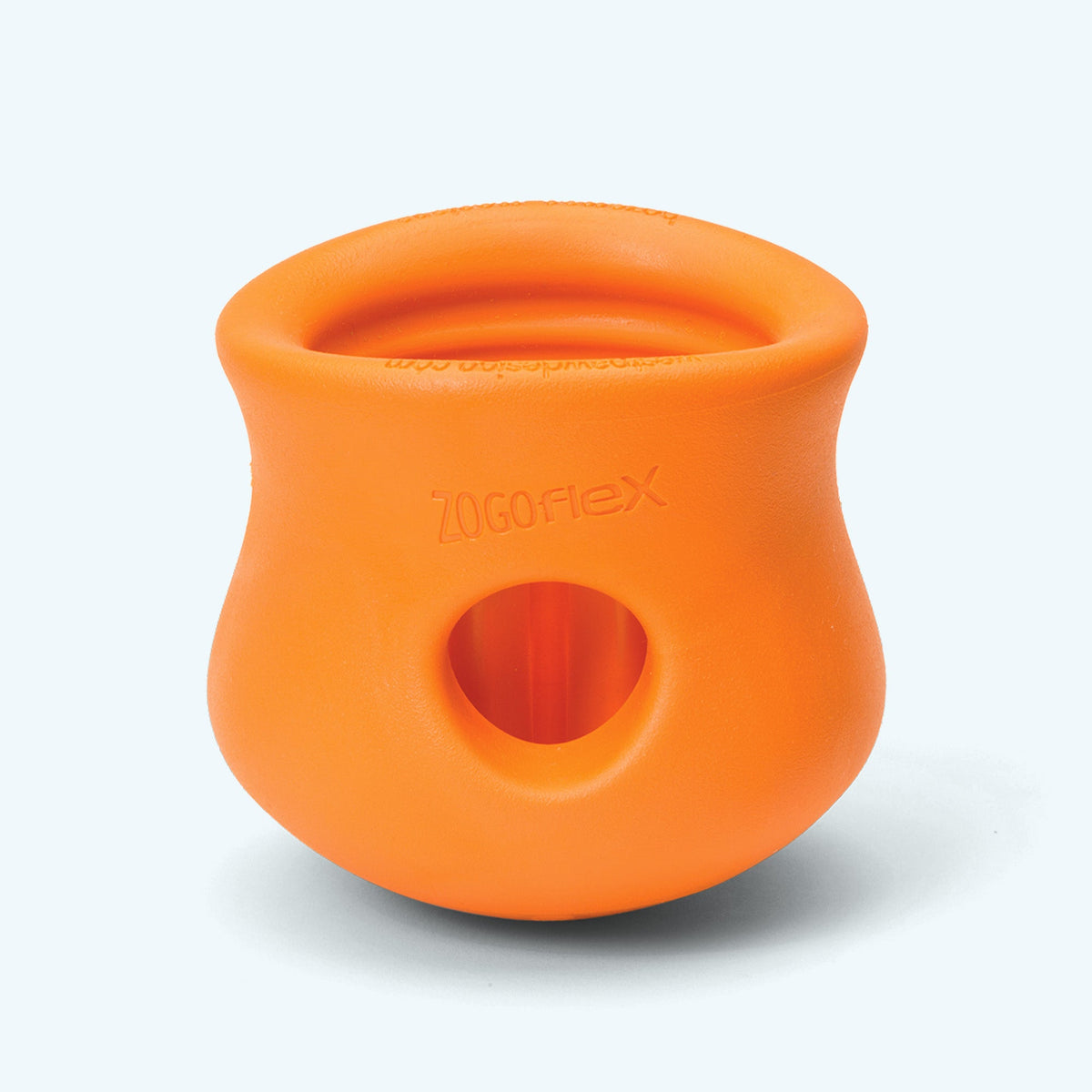 Tangerine West Paw Toppl toy shown alone, with its top opening and side hole visible.