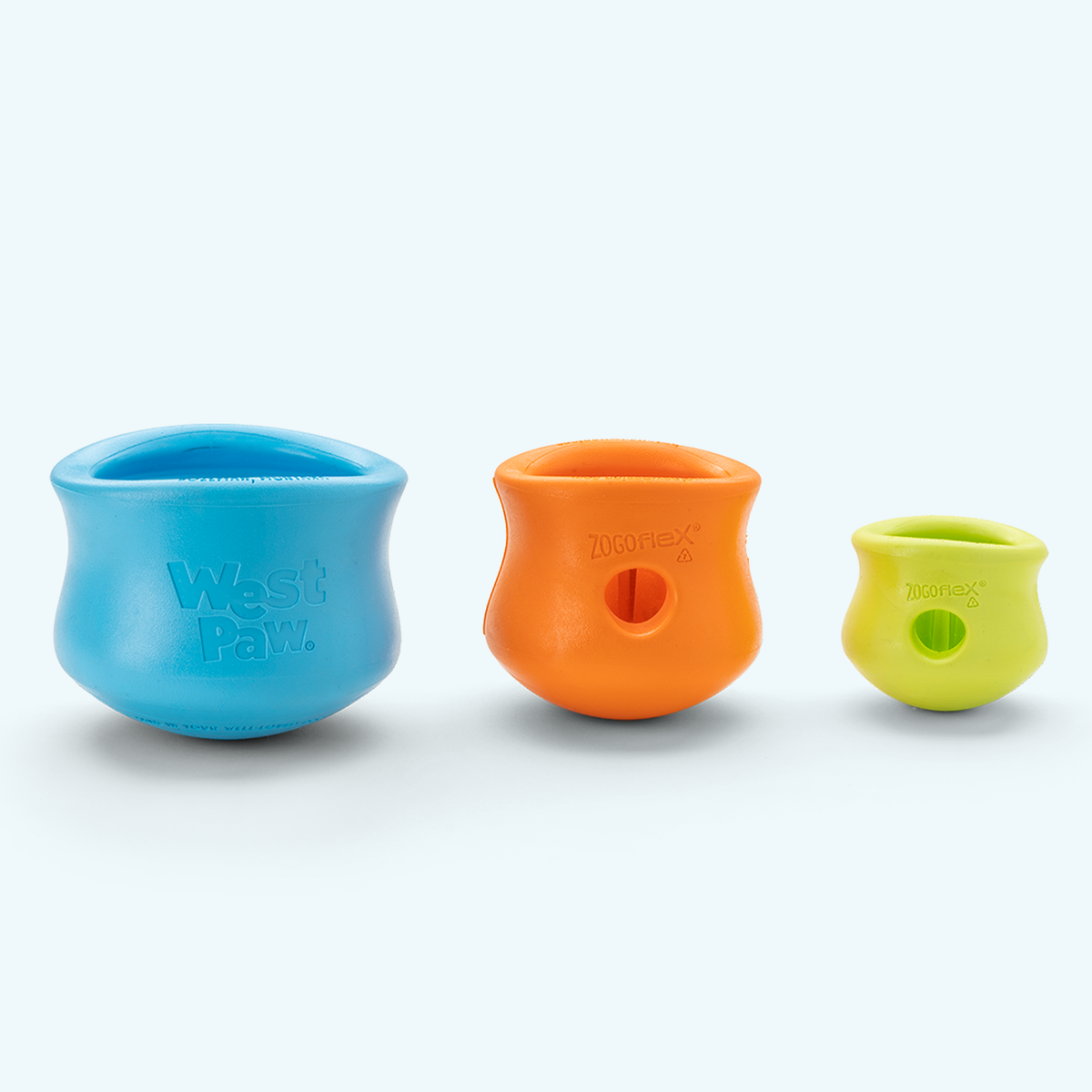 West Paw Toppl toys in Aqua Blue, Tangerine, and Granny Smith; these are color options, not a three-toy set.