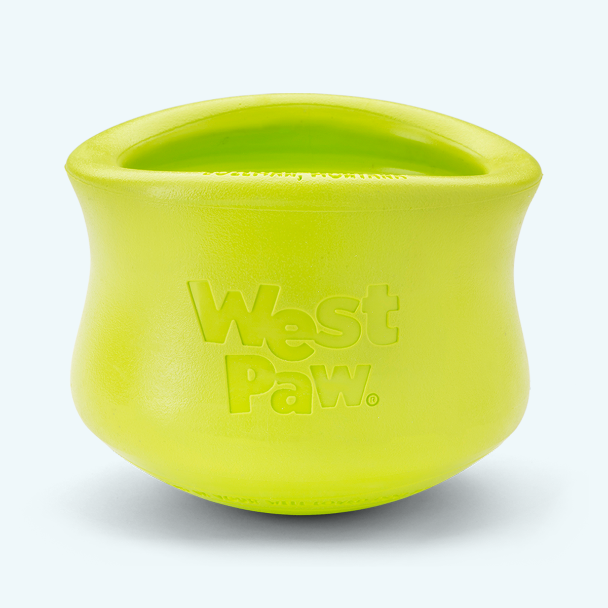 Granny Smith West Paw Toppl treat toy shown alone, with its top and side openings visible.