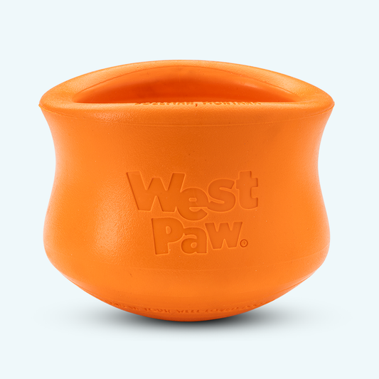 Tangerine West Paw Toppl treat toy shown alone, with its top opening visible.