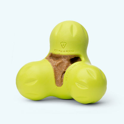Granny Smith green West Paw Tux treat toy shown from the front, with its three lobes and shallow treat cavity visible.