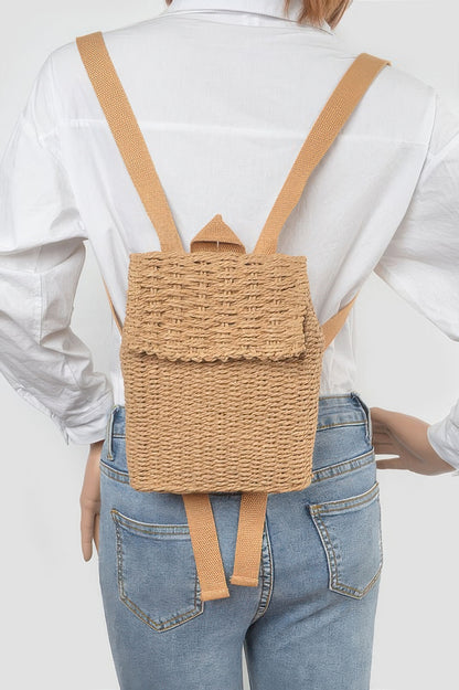 Khaki woven cotton mini backpack worn on the back