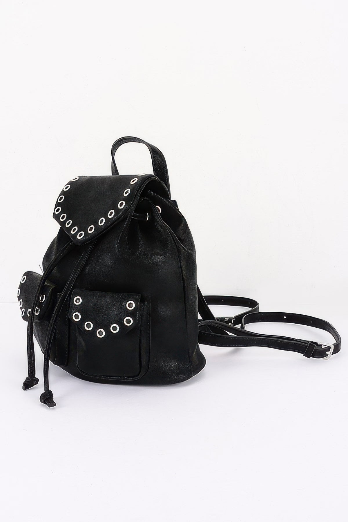 Black faux-leather backpack, side view showing the front pocket and shoulder straps.
