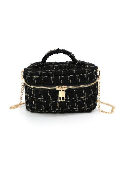 Front view of the black tweed vanity bag with zip closure and top handle