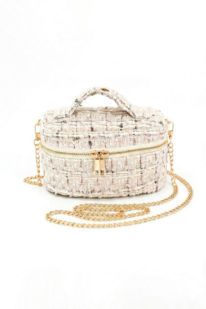 Front view of ivory tweed vanity bag with zip closure and chain strap