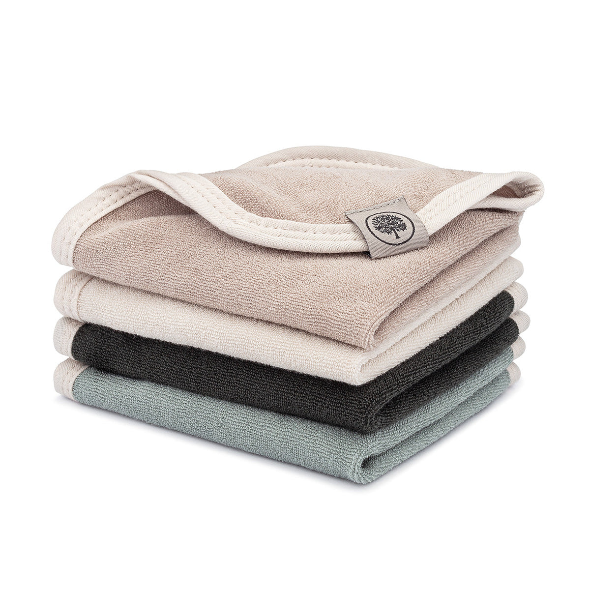 Four folded terry washcloths in neutral colors, stacked on a white background.