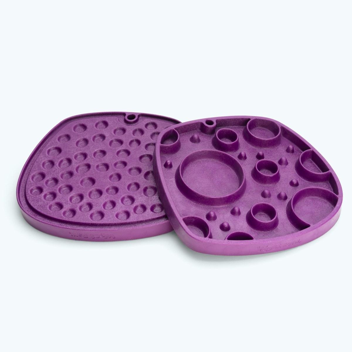 Tropic Red Bubbles Feast Mat showing both textured sides; one mat is included.
