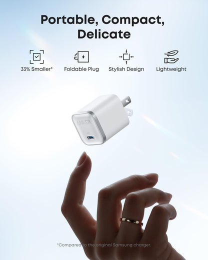 Anker Nano 45W — Aurora White compact charger with foldable plug shown above a hand