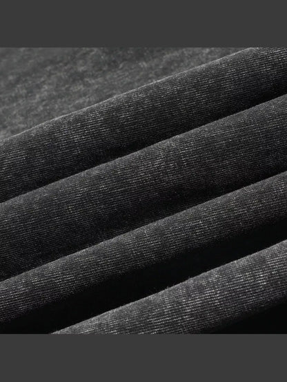 Close-up of the black shirt fabric and seam.