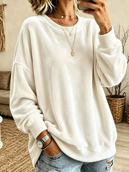 Velvet crewneck sweatshirt — White front view. One sweatshirt only; jewellery and jeans are styling items, not included.