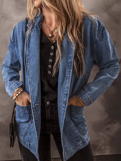 Medium blue denim blazer with lapels and front pockets, layered over a black top; styling items excluded