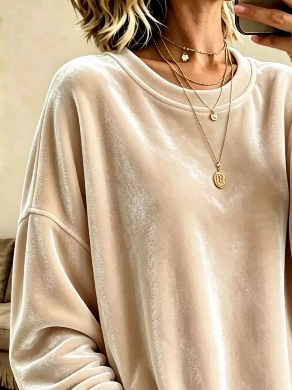 Velvet crewneck sweatshirt — Apricot neckline and fabric detail. One sweatshirt only; jewellery and jeans are styling items, not included.