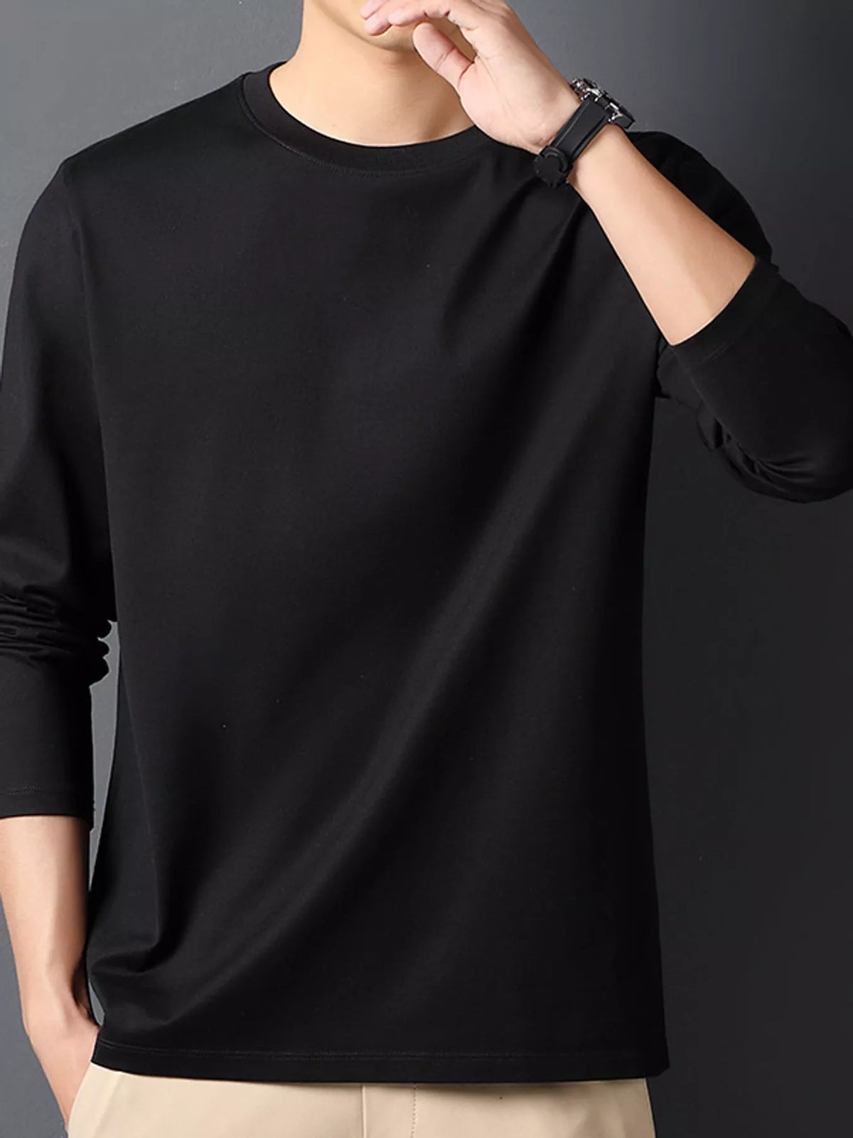 Black men's cotton long-sleeve crewneck tee, front view.