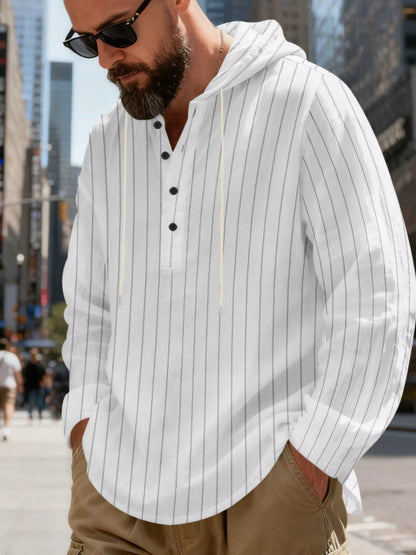 Men's striped Henley hoodie in White — angled front view showing the hood and buttoned neckline; trousers and accessories are styling only.
