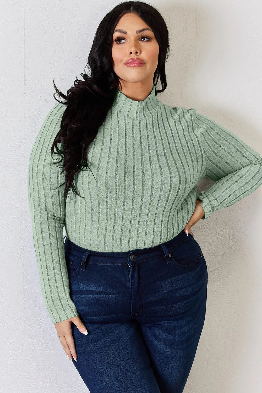 Light Green ribbed mock-neck long-sleeve top, product view; one top included, jeans and accessories excluded