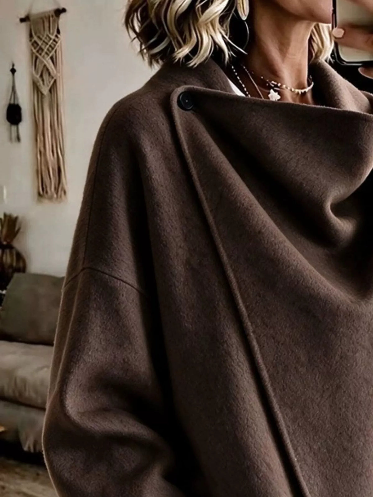 Coffee Brown asymmetric cowl-neck cape, close-up of the draped neckline and button detail