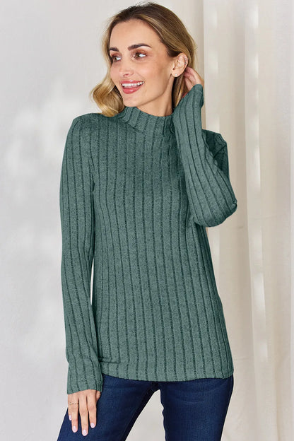 Turquoise ribbed mock-neck long-sleeve top, product view; one top included, jeans and accessories excluded