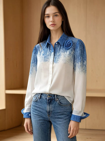Blue-to-white gradient button-up shirt with floral detail and long sleeves, front view on a model