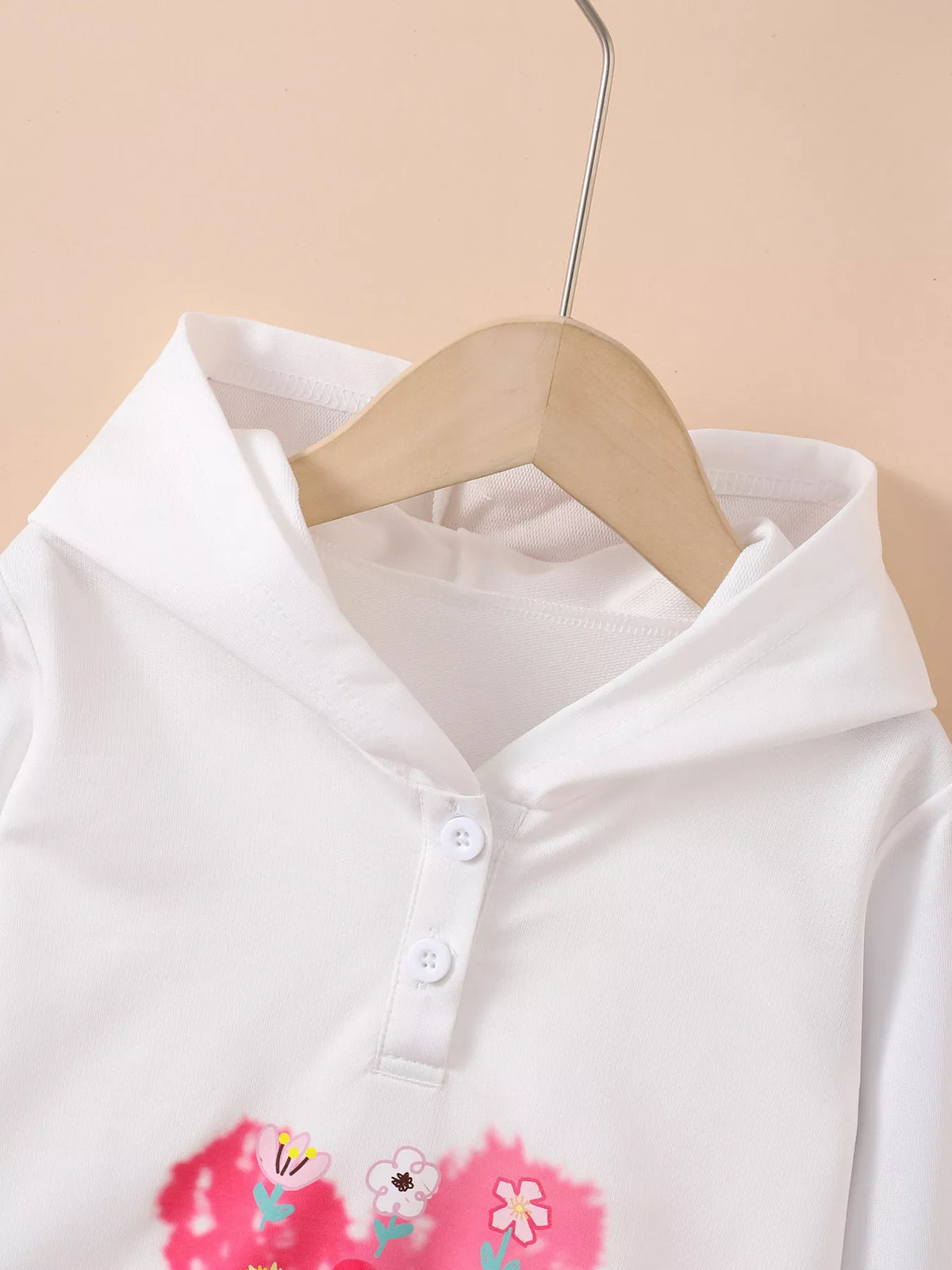 Close-up of hoodie neckline, hood and buttons