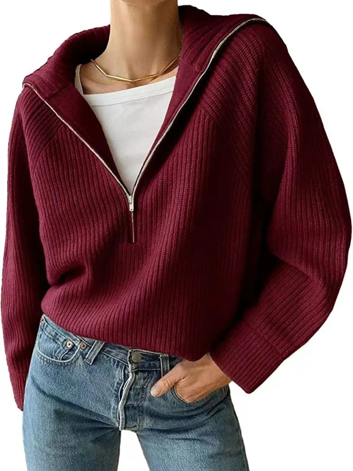 Half-zip long-sleeve ribbed sweater with a high collar.