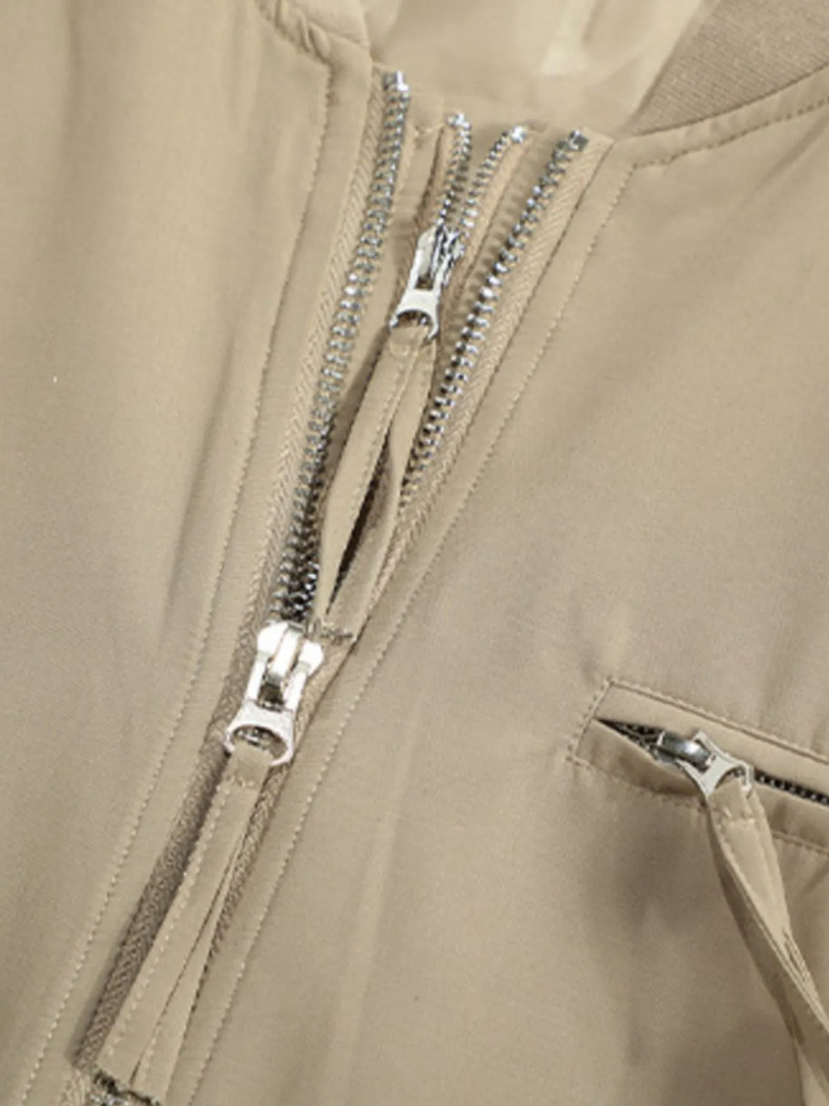 Apricot jacket zipper and chest pocket detail