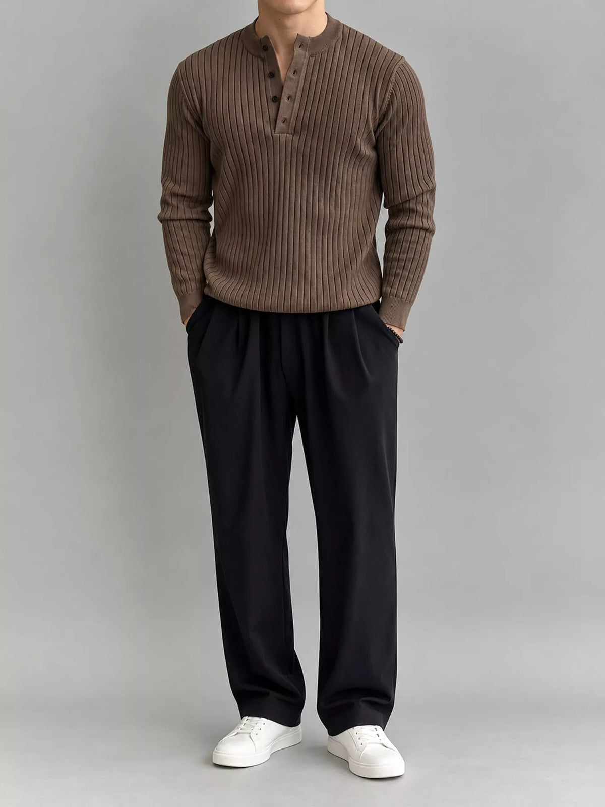 Coffee-colour ribbed long-sleeve knit top with button detailing, modelled front view. One top only; styling pieces not included.