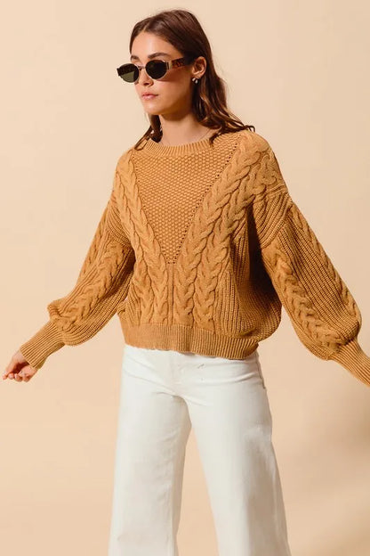 Vintage Camel cable-knit sweater, angled front view with sleeves extended