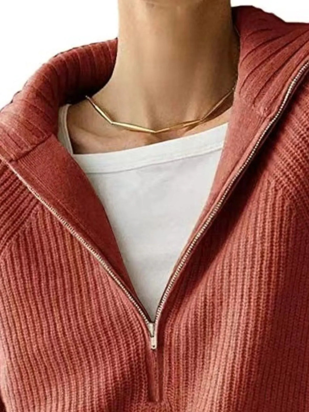 Half-zip long-sleeve ribbed sweater with a high collar.