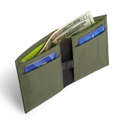 Green COR Surf bifold wallet open, showing the card pockets; cards are display props.
