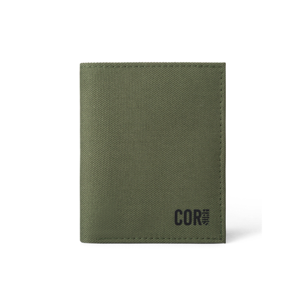 Green COR Surf bifold wallet closed, showing its textured exterior and COR logo.