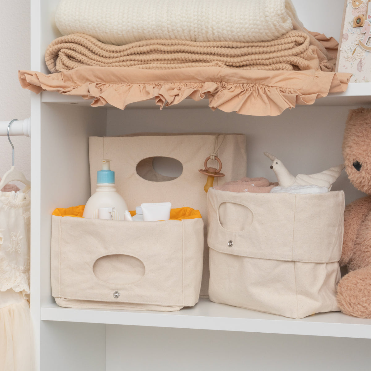 Canvas storage baskets styled on a shelf; accessories not included