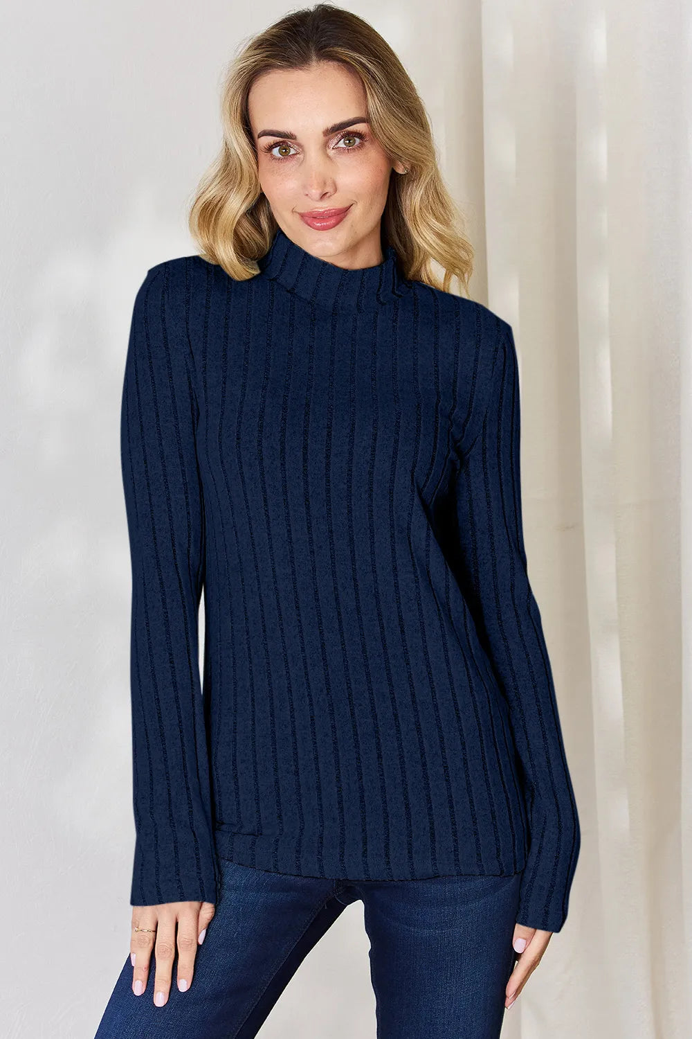 Dark Blue ribbed mock-neck long-sleeve top, product view; one top included, jeans and accessories excluded