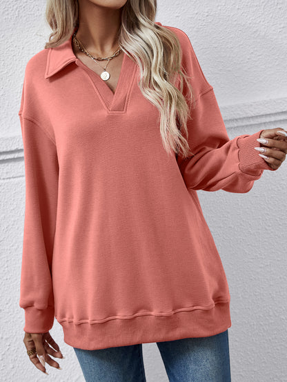 Collared dropped-shoulder sweatshirt with long sleeves.