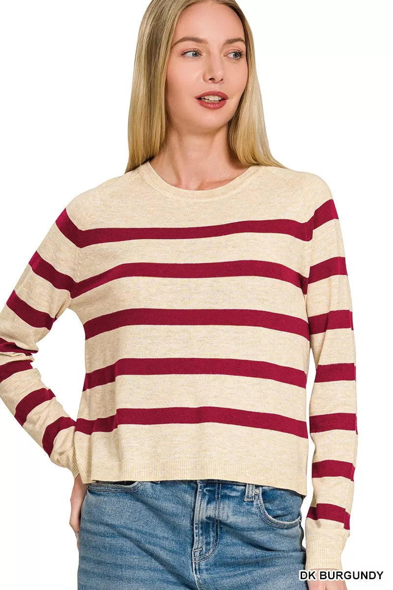 Front view of the oatmeal-and-burgundy striped Zenana round-neck sweater; jeans are styling only.
