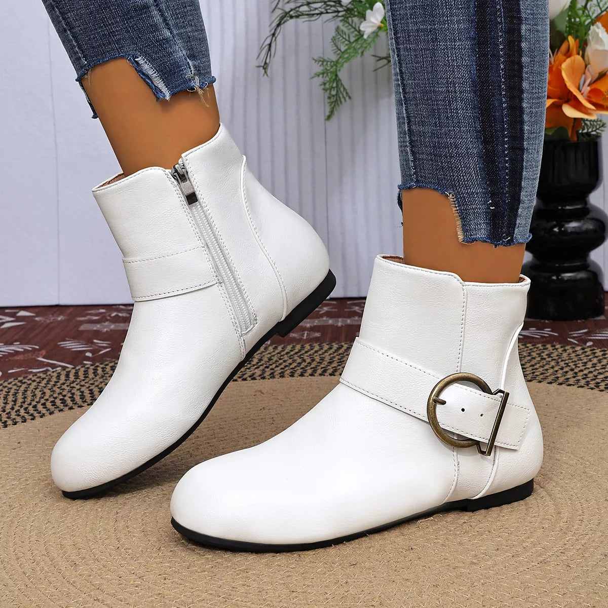 White ankle boots showing heel and buckle detail