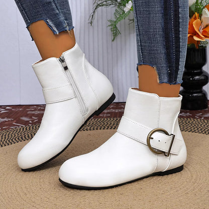 White ankle boots showing heel and buckle detail