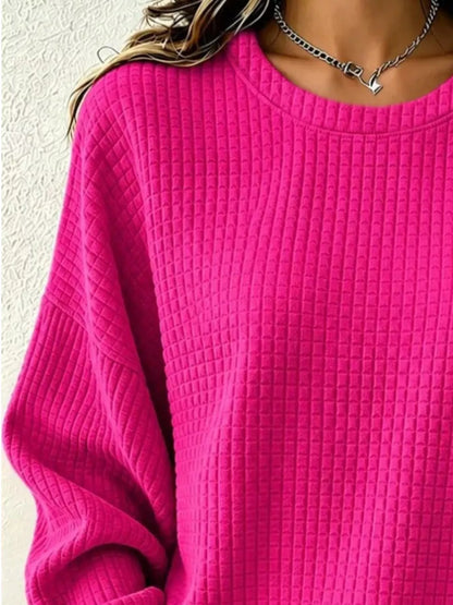 Close-up of the Fuchsia Pink sweatshirt's crew neckline and waffle-knit texture.
