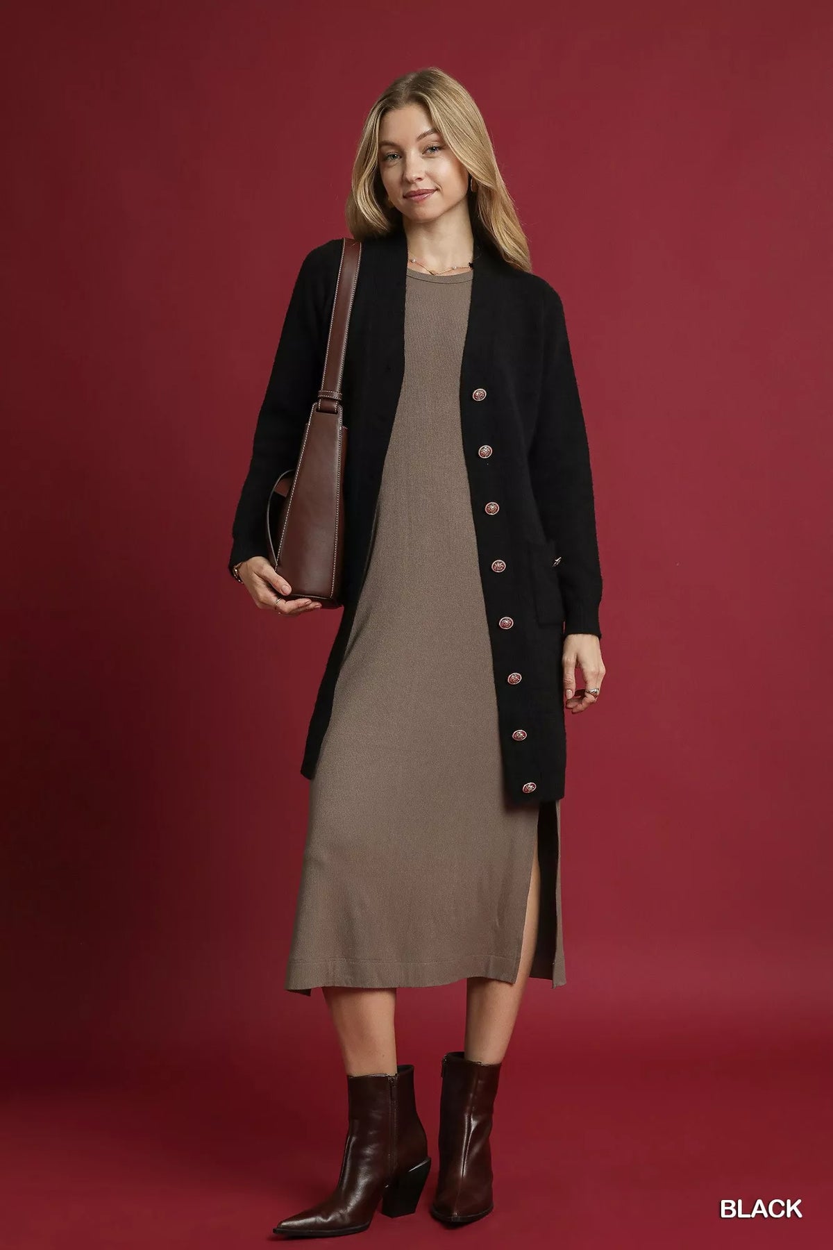 Full outfit view of black Umgee pocket cardigan over a taupe dress with a bag and boots; only the cardigan is included.