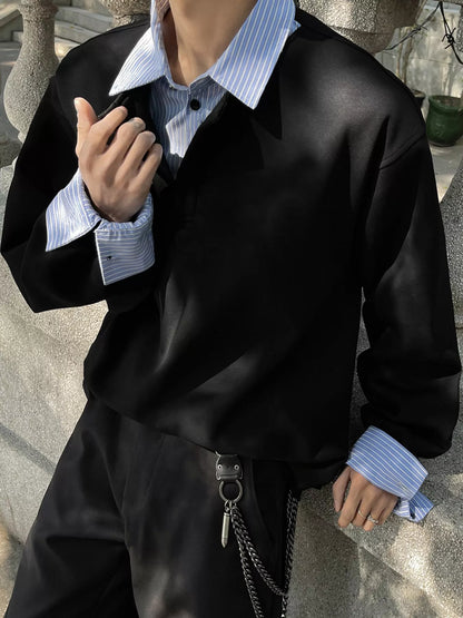 Black layered-look sweatshirt with striped collar and cuffs, front detail; styling accessories excluded