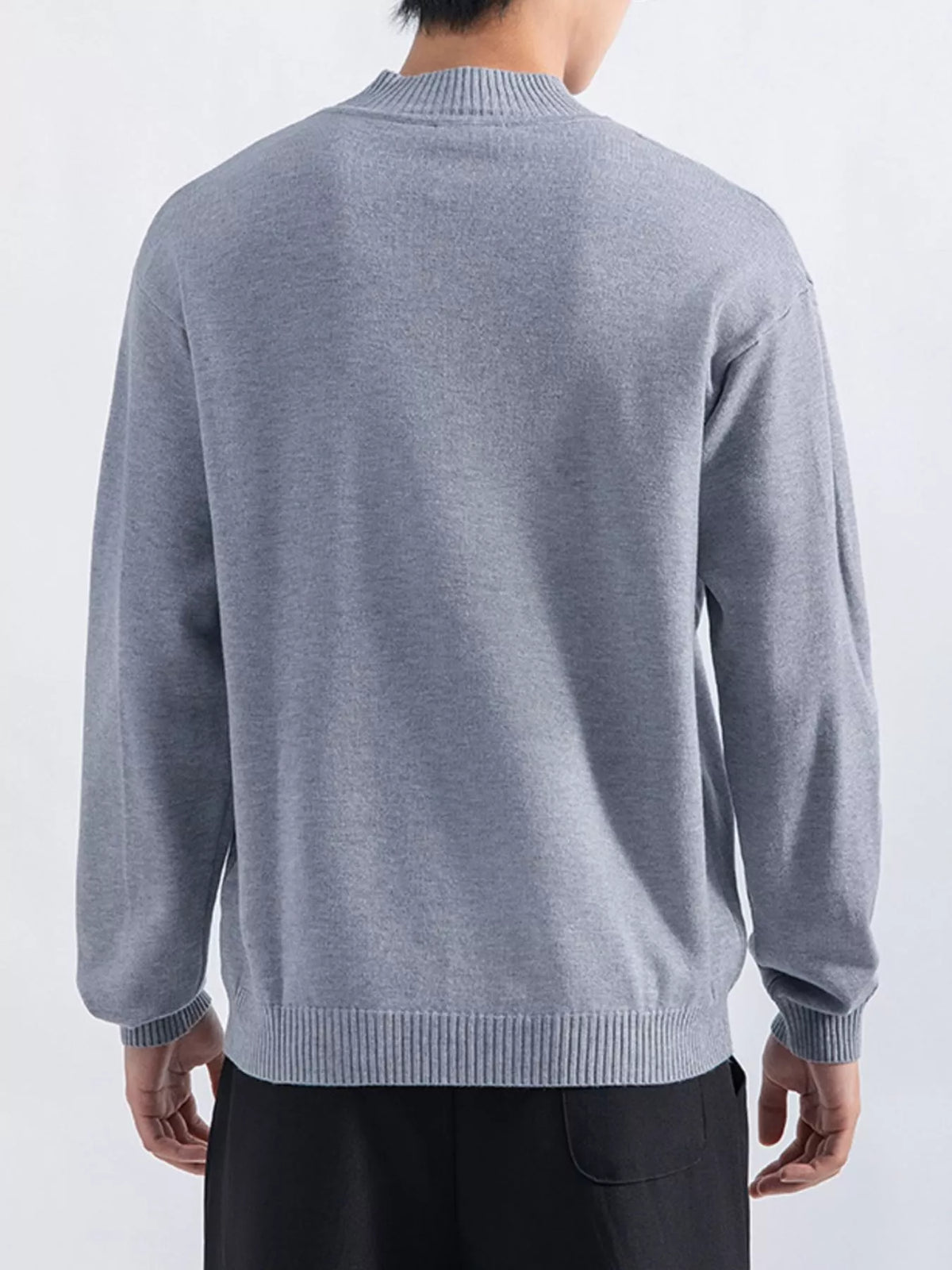 Men's Gray minimalist mock-neck sweater, back view. Trousers are styling items and are not included.