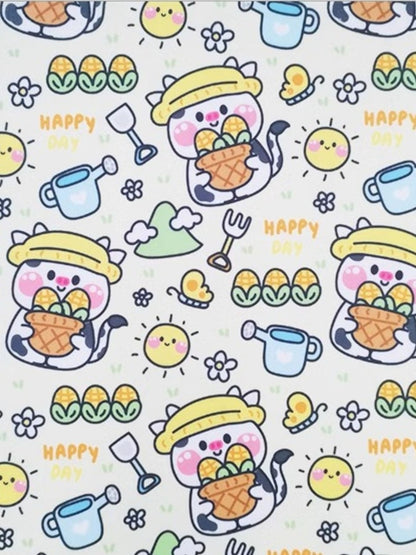 Close-up of the Milk Corn pet towel print with cartoon cups, baskets and HAPPY lettering.