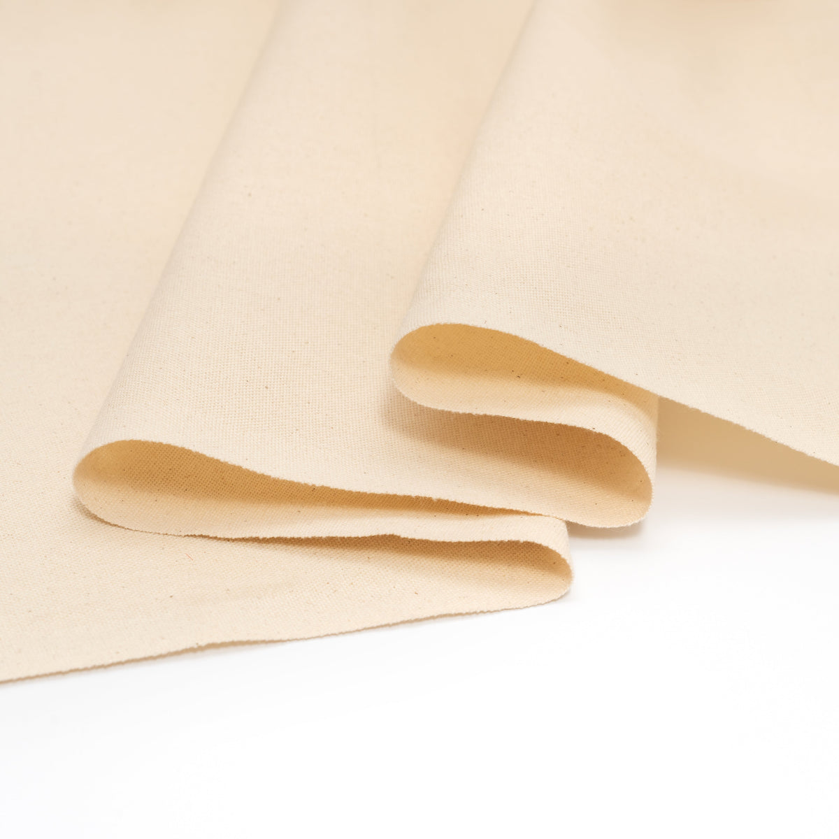 Natural cotton canvas fabric showing folded edge and thickness