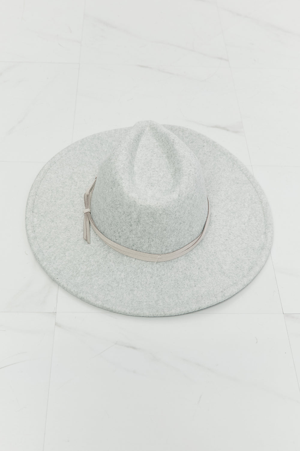 Fame light-gray fedora hat with faux-leather knot band — angled view