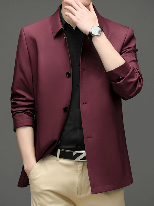 Red button-front jacket with a pointed collar, shown over a separate shirt and trousers; styling accessories are not included.