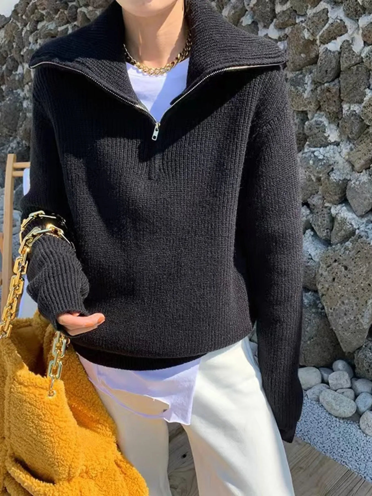 Half-zip long-sleeve ribbed sweater with a high collar.