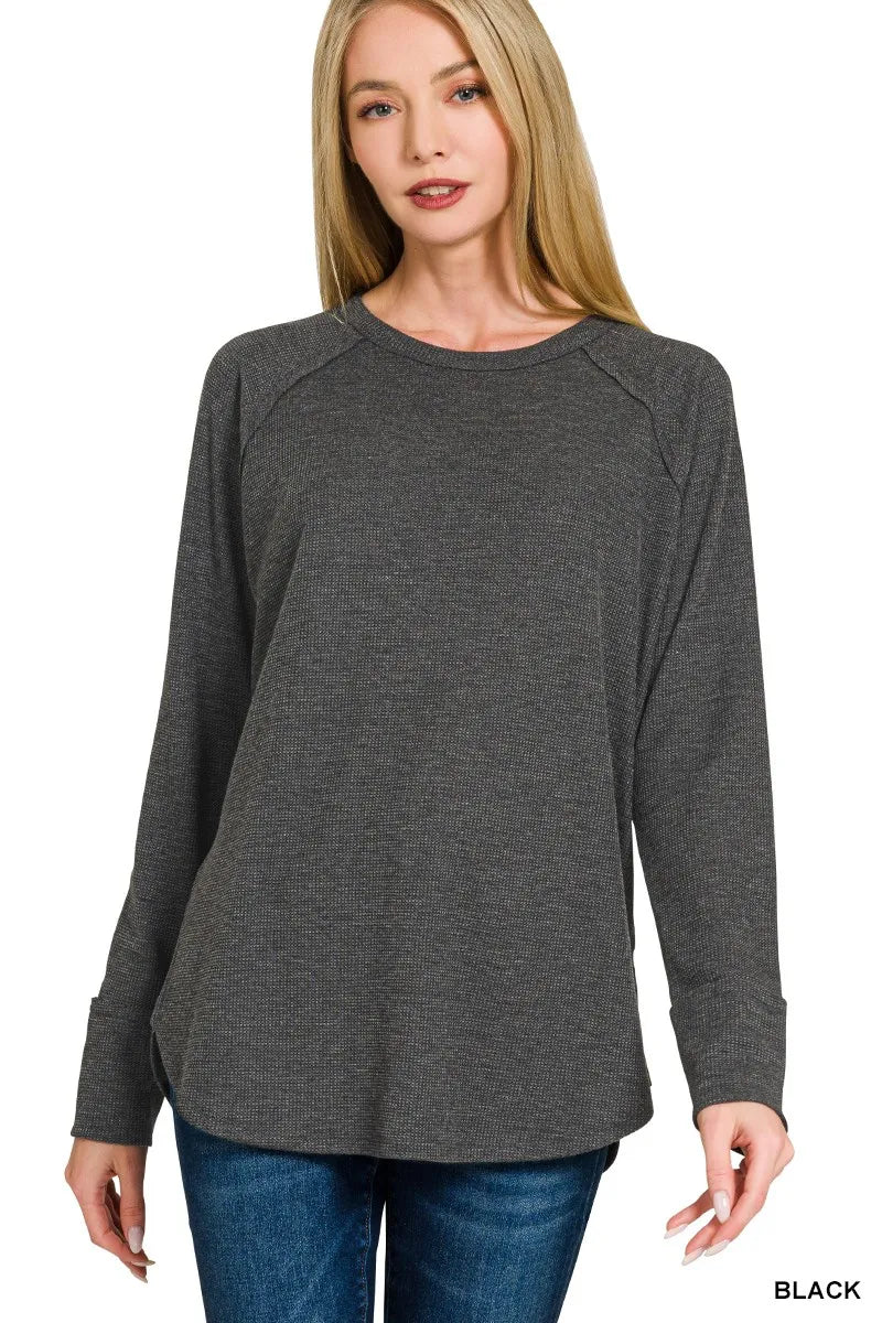 Black Zenana waffle-knit top, front view showing long raglan sleeves