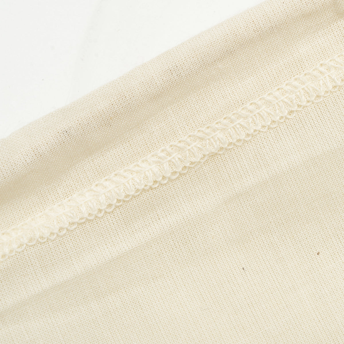 Close-up of cotton straining bag stitching
